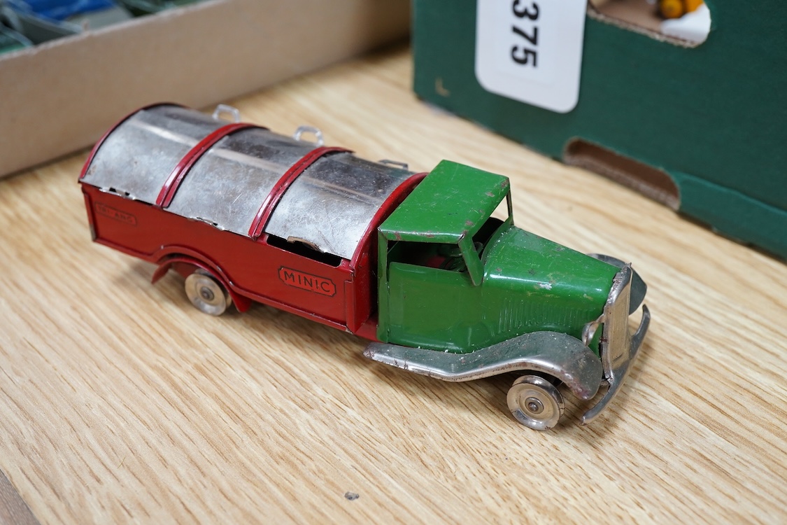 Twenty-seven Dinky Toys and Tri-ang Minic clockwork tinplate vehicles, including Dinky 38 and 39 series British and American cars, a Foden DG flatbed, a Tri-ang Minic double deck London Transport bus, two refuse wagons,